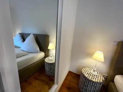 Ein Bett oder Betten in einem Zimmer der Unterkunft Alpen Lodge in Osterhofen - Berge, Ruhe & Natur
