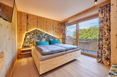 Ein Bett oder Betten in einem Zimmer der Unterkunft Bichl Ferienwohnungen