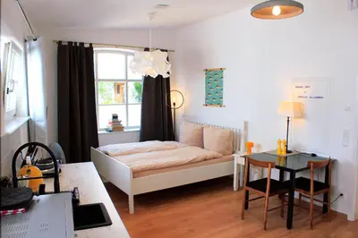 Ein Bett oder Betten in einem Zimmer der Unterkunft SEEZEIT Ferienwohnungen am Mühlbach BRIGHT Collection