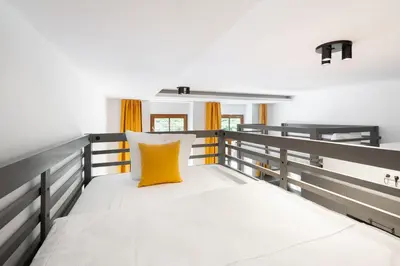 Ein Bett oder Betten in einem Zimmer der Unterkunft Servus Apartments by Homaris