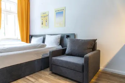 Ein Bett oder Betten in einem Zimmer der Unterkunft Servus Apartments by Homaris