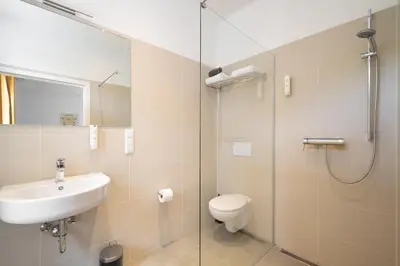 Ein Badezimmer in der Unterkunft Servus Apartments by Homaris