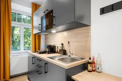 Küche/Küchenzeile in der Unterkunft Servus Apartments by Homaris