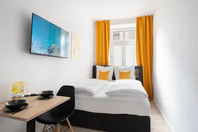 Ein Bett oder Betten in einem Zimmer der Unterkunft Servus Apartments by Homaris