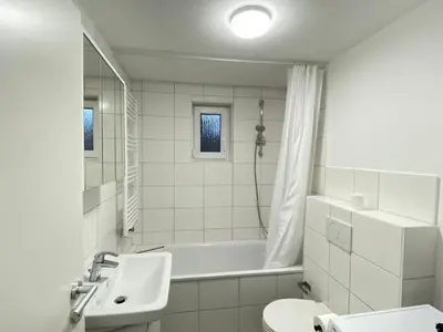 Ein Badezimmer in der Unterkunft LUXOMES: Design Apartment - private Parking - 4 People