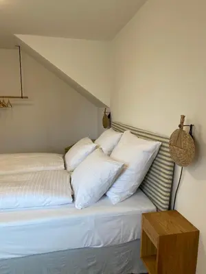 Ein Bett oder Betten in einem Zimmer der Unterkunft Alte Mühle Maising