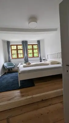 Ein Bett oder Betten in einem Zimmer der Unterkunft LIBORIA I Als Gruppe im Denkmal Augsburgs