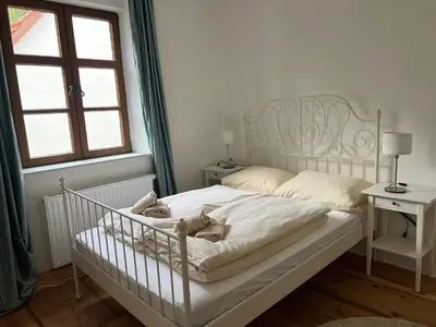 Ein Bett oder Betten in einem Zimmer der Unterkunft LIBORIA I Als Gruppe im Denkmal Augsburgs