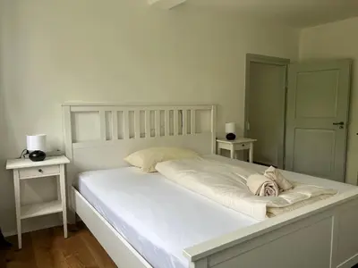 Ein Bett oder Betten in einem Zimmer der Unterkunft LIBORIA I Als Gruppe im Denkmal Augsburgs