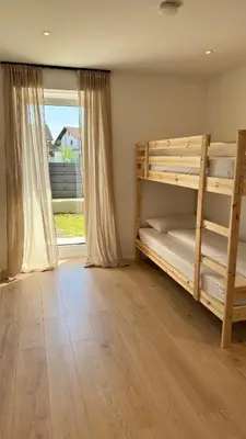 Ein Bett oder Betten in einem Zimmer der Unterkunft Römer Apartment und Zimmer