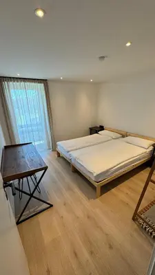 Ein Bett oder Betten in einem Zimmer der Unterkunft Römer Apartment und Zimmer