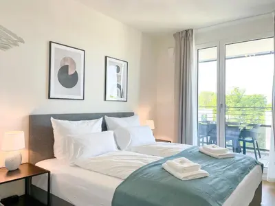 Ein Bett oder Betten in einem Zimmer der Unterkunft UNiQE- 6 pers - design apartment - fair - SKY-TV - parking