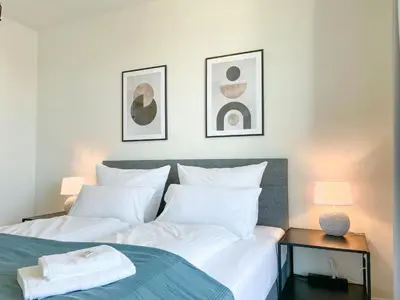 Ein Bett oder Betten in einem Zimmer der Unterkunft UNiQE- 6 pers - design apartment - fair - SKY-TV - parking