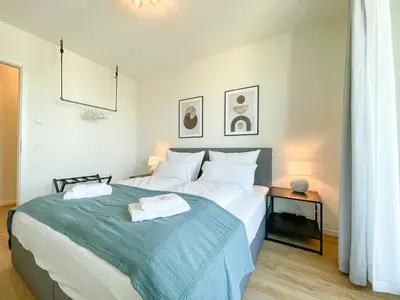 Ein Bett oder Betten in einem Zimmer der Unterkunft UNiQE- 6 pers - design apartment - fair - SKY-TV - parking