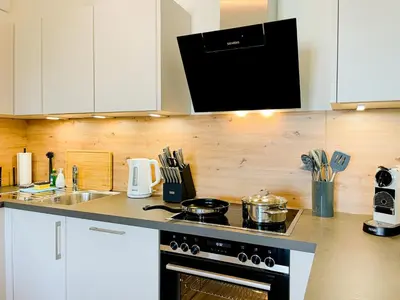 Küche/Küchenzeile in der Unterkunft UNiQE- 6 pers - design apartment - fair - SKY-TV - parking