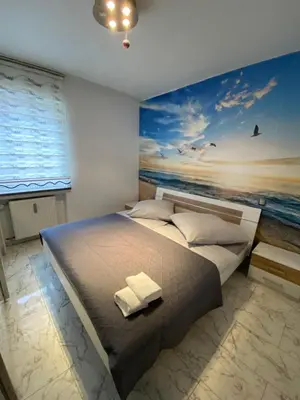 Ein Bett oder Betten in einem Zimmer der Unterkunft 4 ZW m. Blick v. Balkon auf Lech