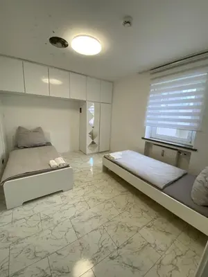 Ein Bett oder Betten in einem Zimmer der Unterkunft 4 ZW m. Blick v. Balkon auf Lech