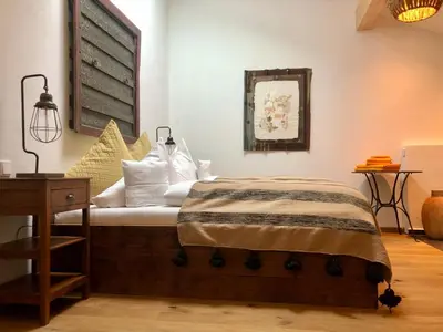 Ein Bett oder Betten in einem Zimmer der Unterkunft Farmhouse 1604 - Das Bauernhaus eines Fischers