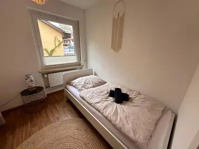 Ein Bett oder Betten in einem Zimmer der Unterkunft Ammersee Bungalow Verstecktes Juwel in Seenähe