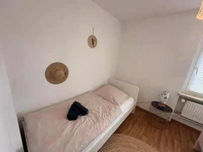 Ein Bett oder Betten in einem Zimmer der Unterkunft Ammersee Bungalow Verstecktes Juwel in Seenähe