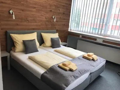 Ein Bett oder Betten in einem Zimmer der Unterkunft CREO Munich City