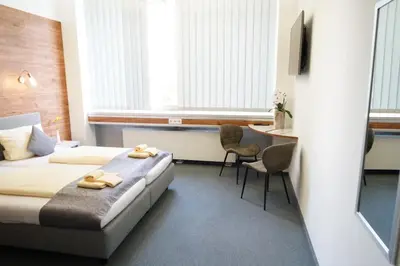 Ein Bett oder Betten in einem Zimmer der Unterkunft CREO Munich City