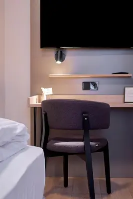 Ein Bett oder Betten in einem Zimmer der Unterkunft Hotel Müllerbräu