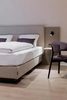 Ein Bett oder Betten in einem Zimmer der Unterkunft Hotel Müllerbräu