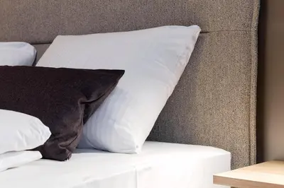 Ein Bett oder Betten in einem Zimmer der Unterkunft Hotel Müllerbräu