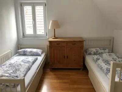 Ein Bett oder Betten in einem Zimmer der Unterkunft Ferienhaus Chiemsee