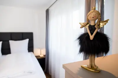 Ein Bett oder Betten in einem Zimmer der Unterkunft Ferienwohnung RottachSuite