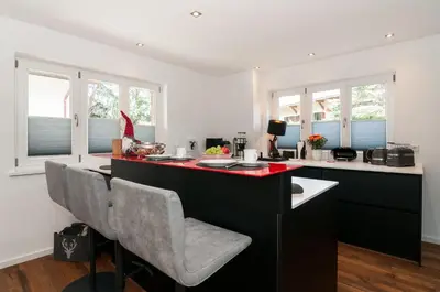 Der Geschäftsbereich oder Konferenzraum in der Unterkunft Ferienwohnung RottachSuite
