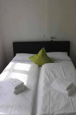 Ein Bett oder Betten in einem Zimmer der Unterkunft meywohnen Stadthaus Bad Aibling