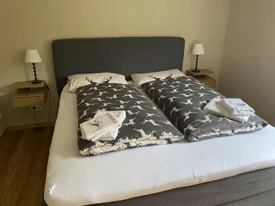 Ein Bett oder Betten in einem Zimmer der Unterkunft Ferienwohnung Partnacheck