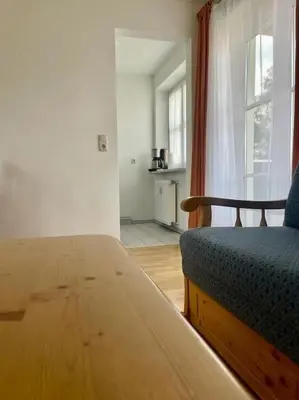 Ein Bett oder Betten in einem Zimmer der Unterkunft Ferienwohnung Lilie - zentral in Bad Wiessee