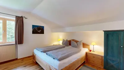 Ein Bett oder Betten in einem Zimmer der Unterkunft Fischer`s Postresidenzen Ettal