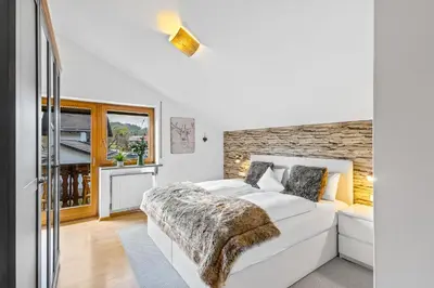 Ein Bett oder Betten in einem Zimmer der Unterkunft CASARINA - Alpenblick am Barmsee - FeWo Katharina