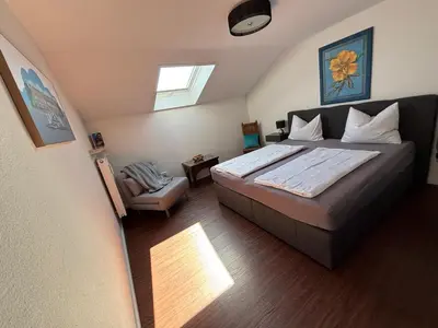 Ein Bett oder Betten in einem Zimmer der Unterkunft Ferienwohnung Baumgartner Chiemseeliebe 2OG