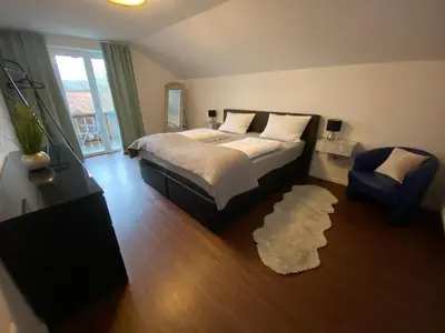 Ein Bett oder Betten in einem Zimmer der Unterkunft Ferienwohnung Baumgartner Chiemseeliebe 2OG