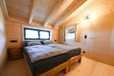 Ein Bett oder Betten in einem Zimmer der Unterkunft Holzwies Chalets