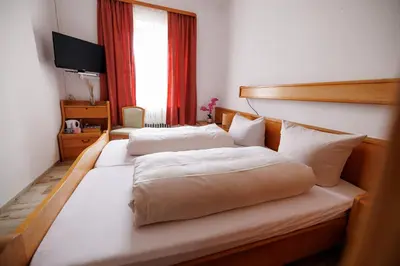 Ein Bett oder Betten in einem Zimmer der Unterkunft Drexl Gasthof Shiro