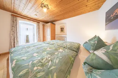 Ein Bett oder Betten in einem Zimmer der Unterkunft Ferienwohnungen Zum Bachl Signalkopf