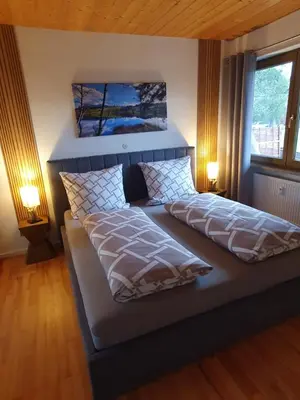 Ein Bett oder Betten in einem Zimmer der Unterkunft Alpenblick mit super Bergblick und Terrasse