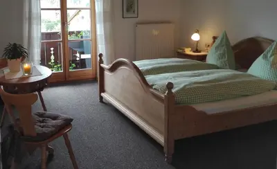 Ein Bett oder Betten in einem Zimmer der Unterkunft Gästehaus Café Habersetzer