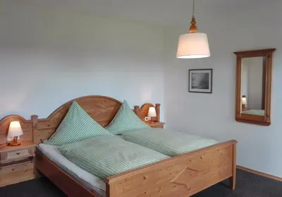 Ein Bett oder Betten in einem Zimmer der Unterkunft Gästehaus Café Habersetzer