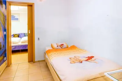 Ein Bett oder Betten in einem Zimmer der Unterkunft Zum Engelreich ruhig, ländlich, stadtnah