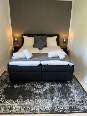 Ein Bett oder Betten in einem Zimmer der Unterkunft UNiQE I Stilvolle 115qm I Terrasse I BBQ