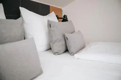 Ein Bett oder Betten in einem Zimmer der Unterkunft Alpenglühen Smart Hotel