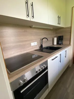 Küche/Küchenzeile in der Unterkunft Ferienwohnung Kaiserpanorama - Alpenmagie Suites