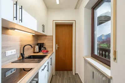 Küche/Küchenzeile in der Unterkunft Ferienwohnung Kaiserpanorama - Alpenmagie Suites